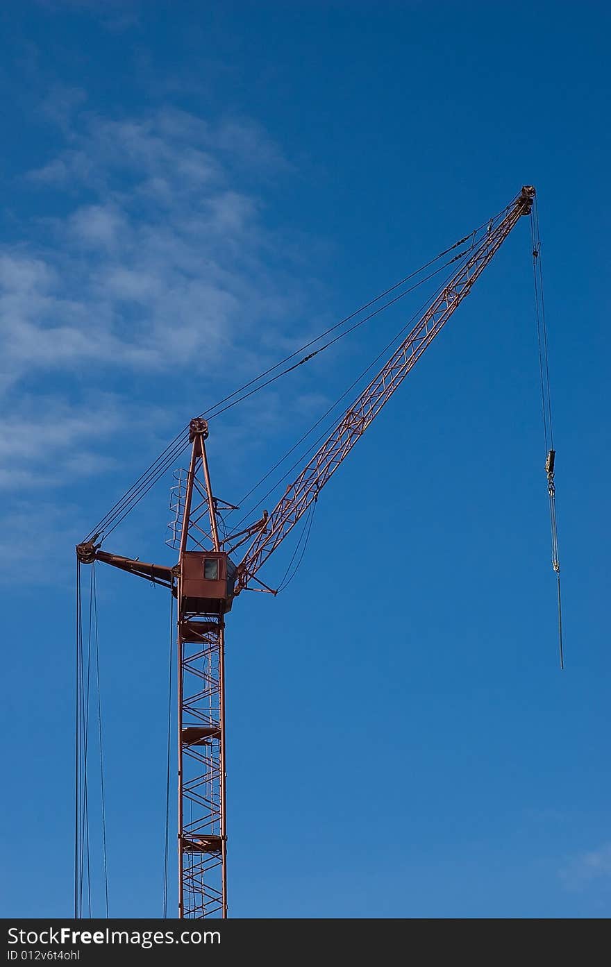 Photo of a tower crane on sky background