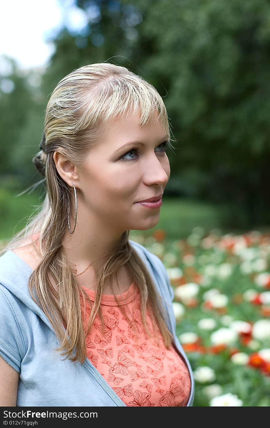 Portrait of the beautiful girl on natural background