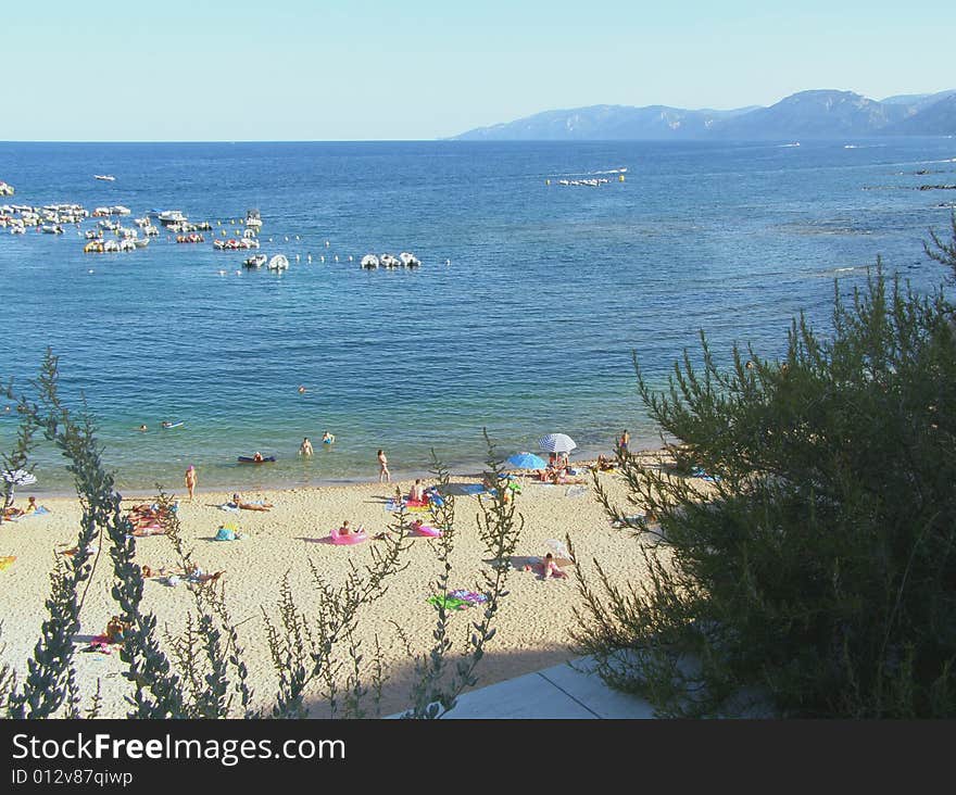 Cala Gonone town beach on Sardinia, Italy (Spiaggia Centrale). Cala Gonone town beach on Sardinia, Italy (Spiaggia Centrale)