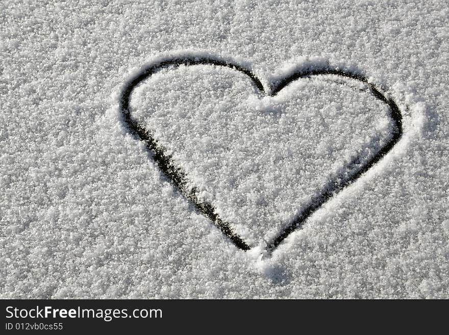 Heart drawn on fresh snow. Heart drawn on fresh snow