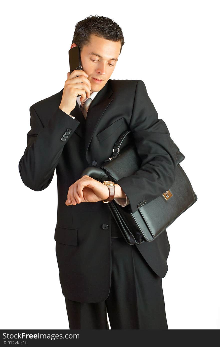 Businessman with cellphone and briefcase