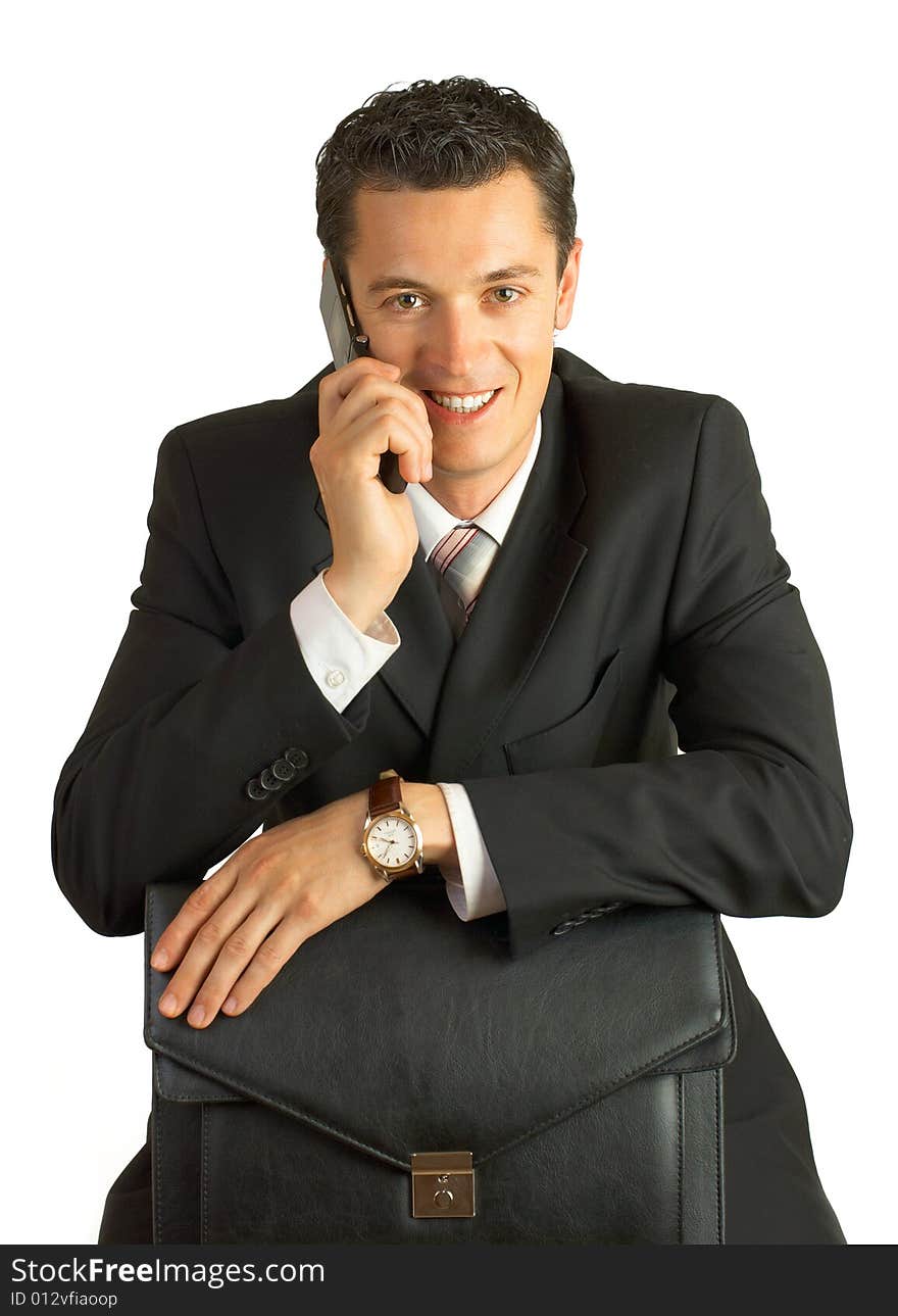 Businessman with cellphone and briefcase