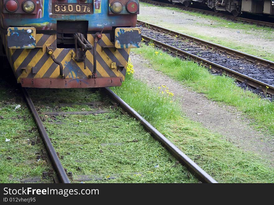 Detail of an old-fashioned train on a railway. Detail of an old-fashioned train on a railway