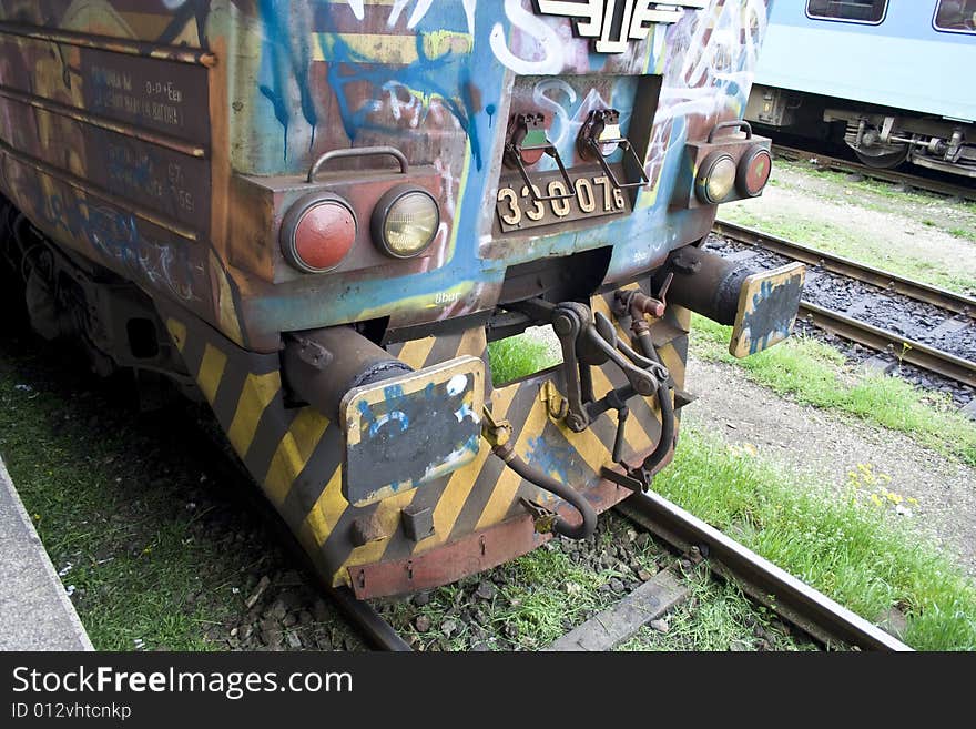 Detail of an old-fashioned train on a railway. Detail of an old-fashioned train on a railway