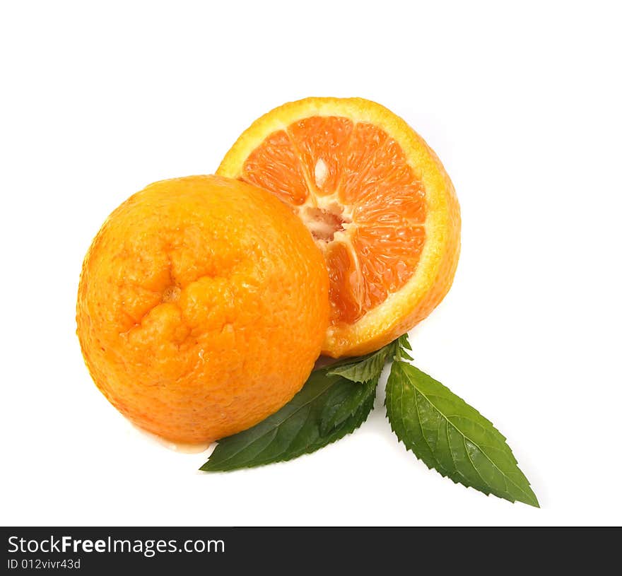 Two half of orange with leaves of mint on a white background.