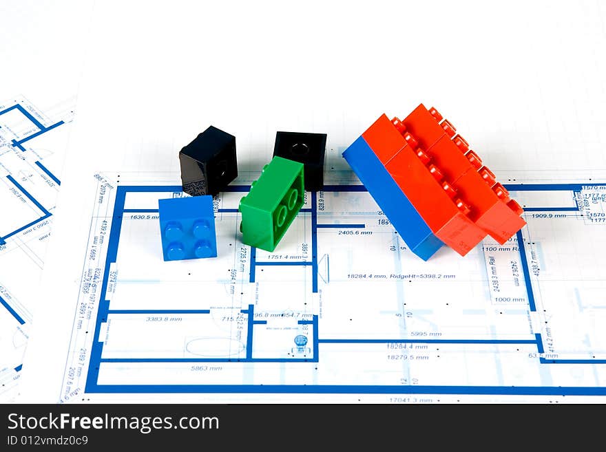 Blueprint for a house and colorful plastic blocks. Blueprint for a house and colorful plastic blocks