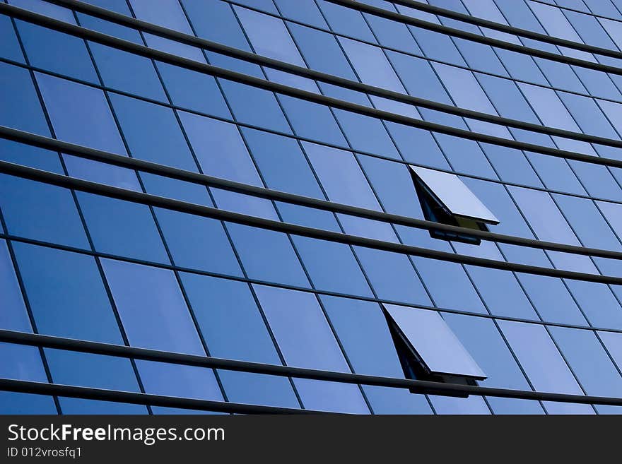 Modern office building glass wall and two windows