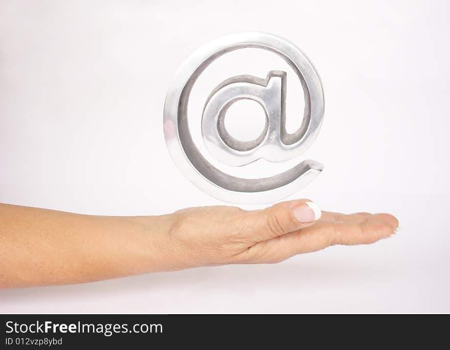 Hand and arroba symbol in white background. Hand and arroba symbol in white background