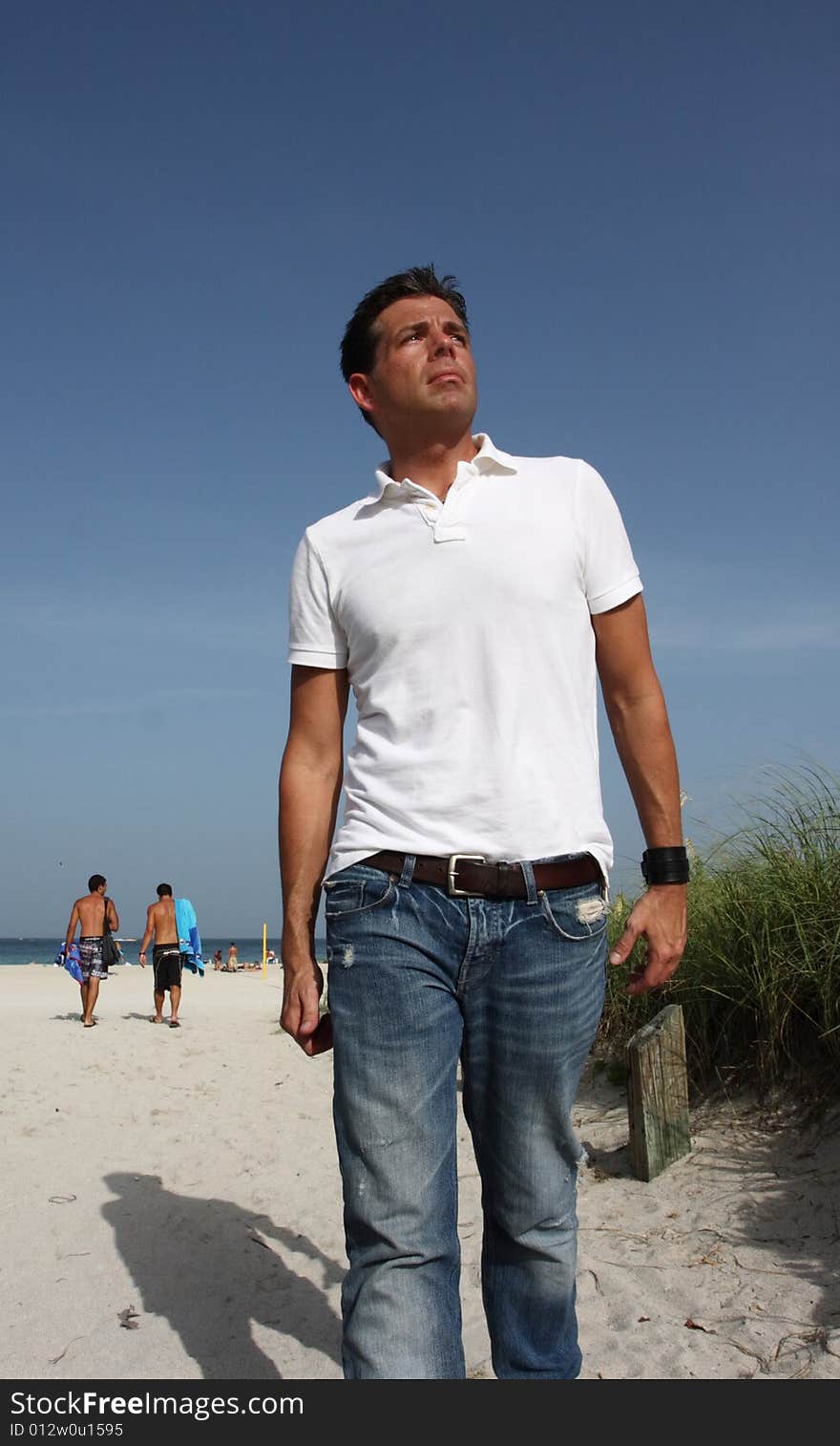 Man Walking From the Beach