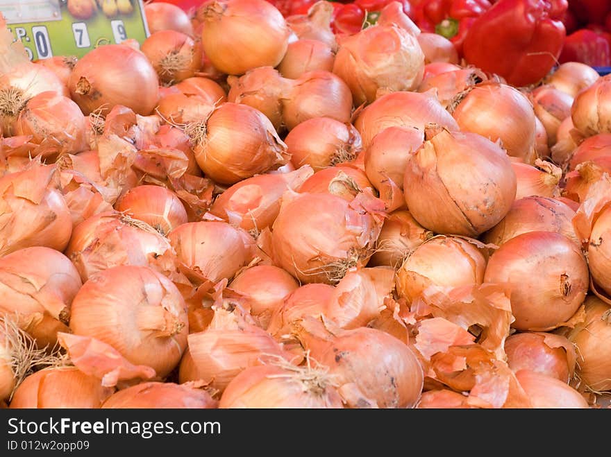 A lot of onions in a street market