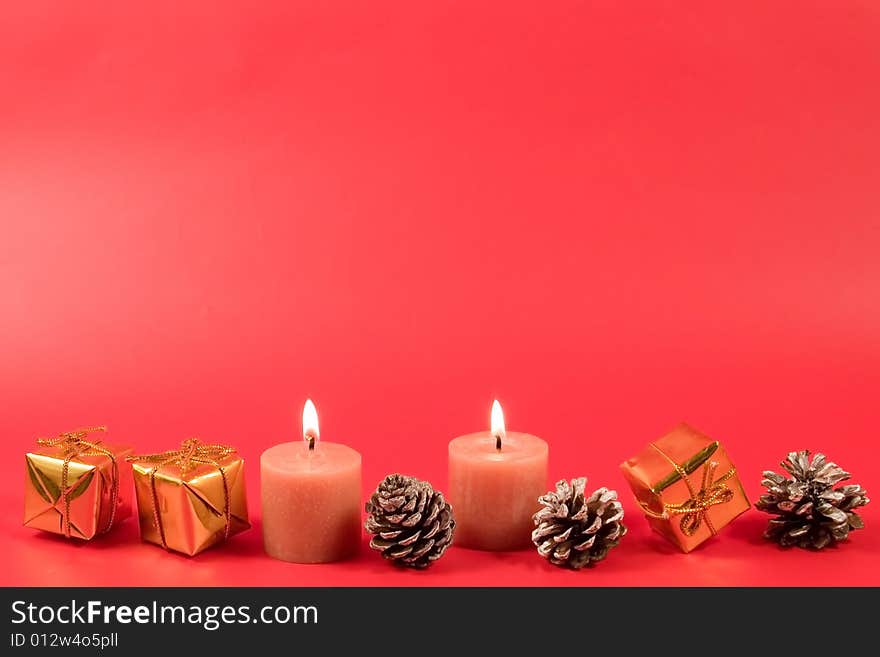 Christmas decoration on a red background (place for the text)