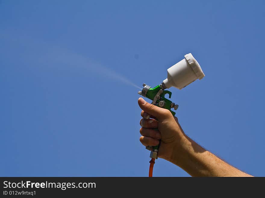 Spraygun on a dark blue background