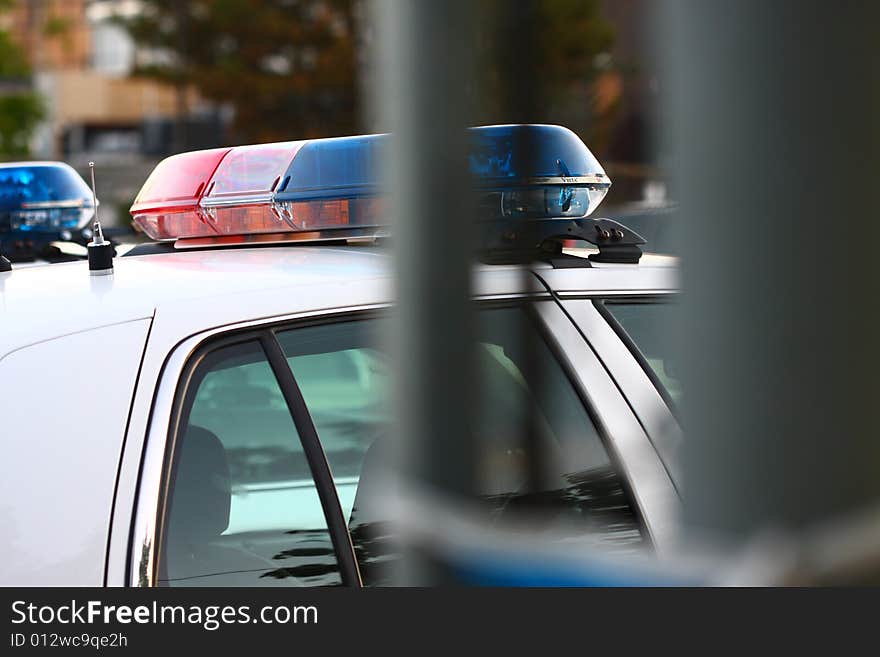 Side view of a police siren thru gate. Side view of a police siren thru gate