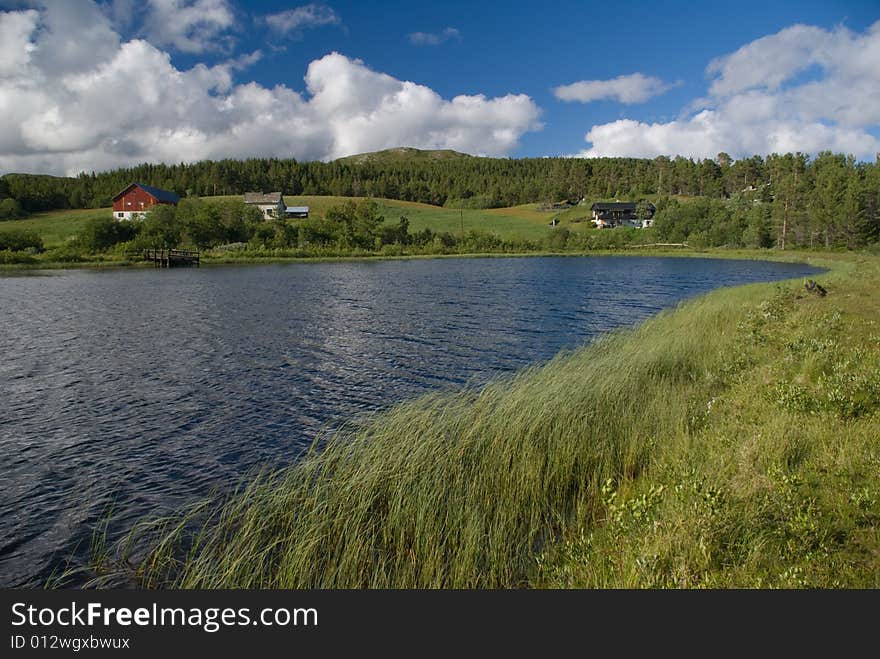 Norway landscape with typical cabin and lake. Norway landscape with typical cabin and lake