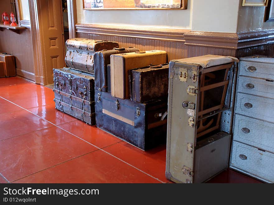 This is a shot of some old style luggage ready to go on a train ride. This is a shot of some old style luggage ready to go on a train ride.