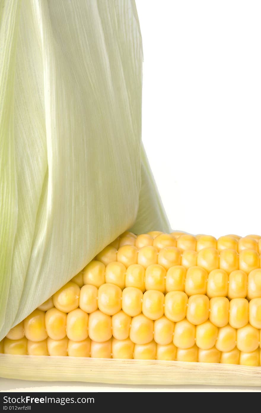 Detail of a fresh corn cob on white background