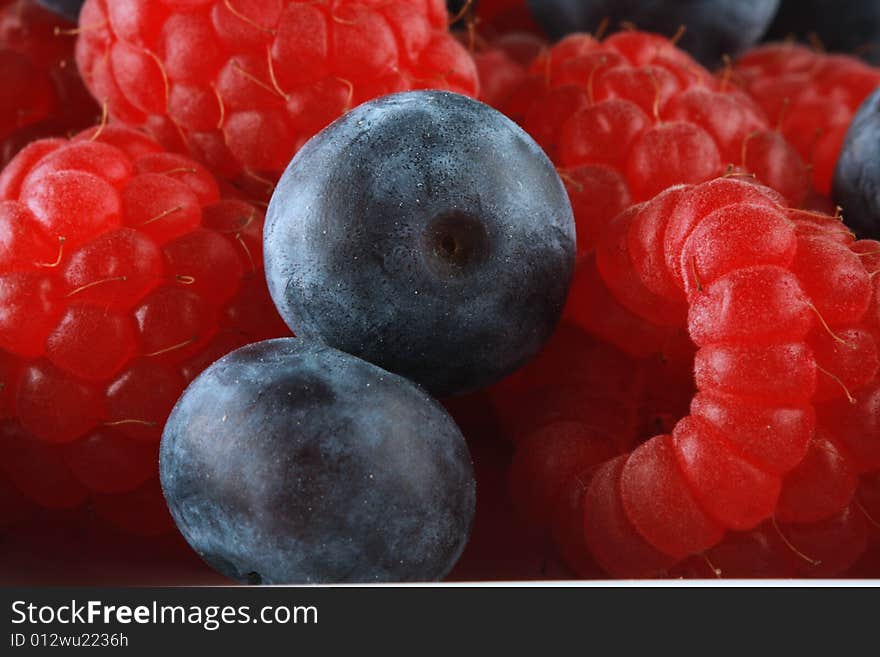 Blueberries and raspberries, shot in studio. Blueberries and raspberries, shot in studio