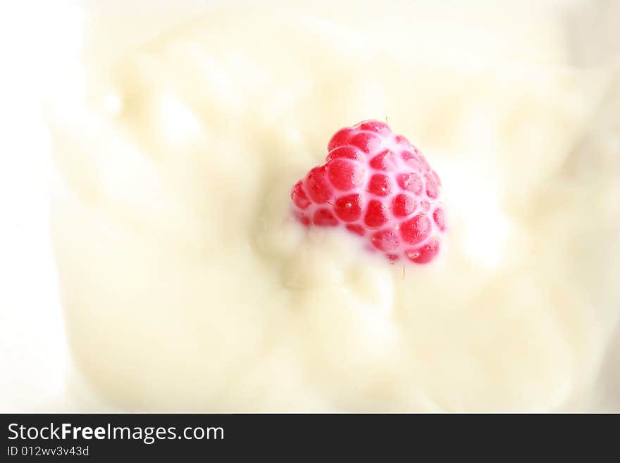 Fresh berry in milk