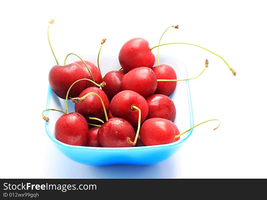 Bowl of fresh red cherries, isolated on white shot in studio. Bowl of fresh red cherries, isolated on white shot in studio