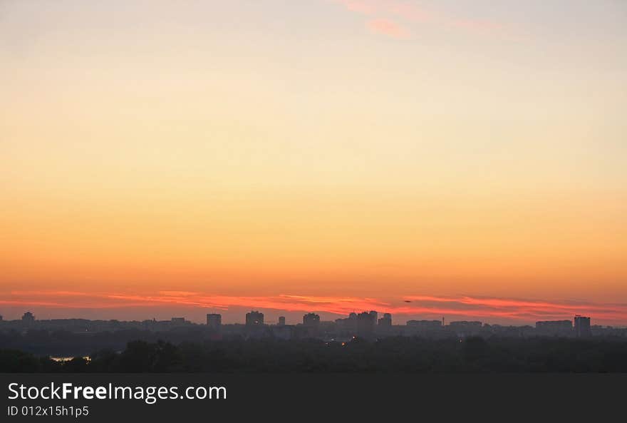 Late sunset over distant city. Late sunset over distant city.