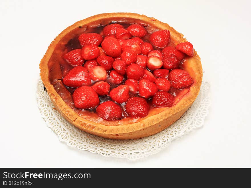 Fresh strawberry cake shot from above, isolated on white. Fresh strawberry cake shot from above, isolated on white