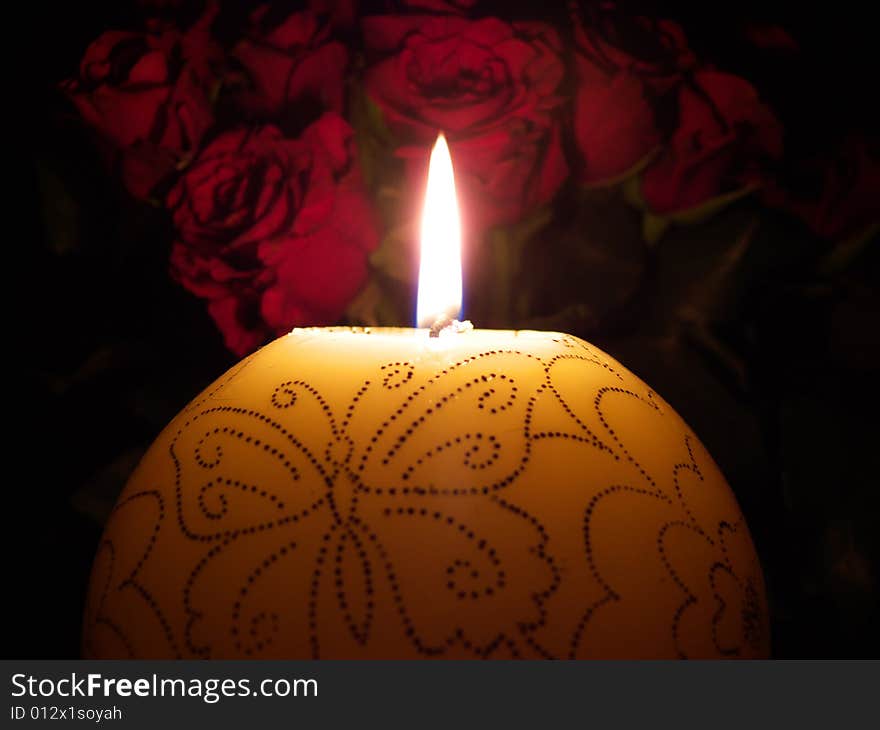 Candle with roses