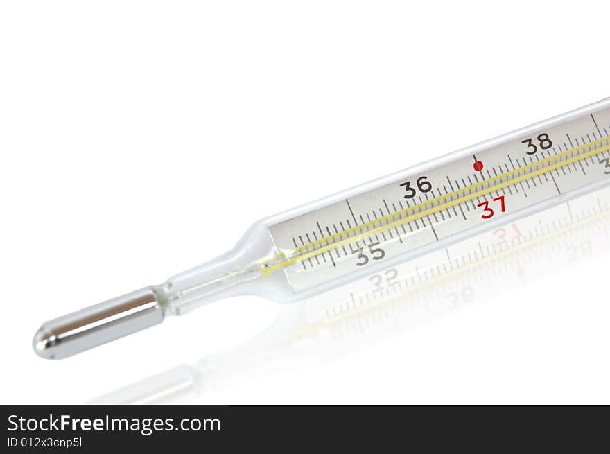 Isolated medical mercury thermometer. Focus on red number.