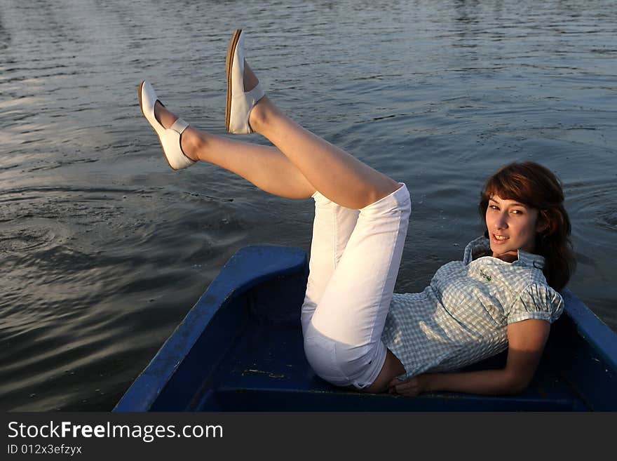 A beautiful lady alone on the boat. A beautiful lady alone on the boat