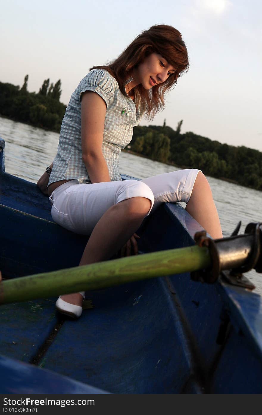 A beautiful lady alone on the boat. A beautiful lady alone on the boat