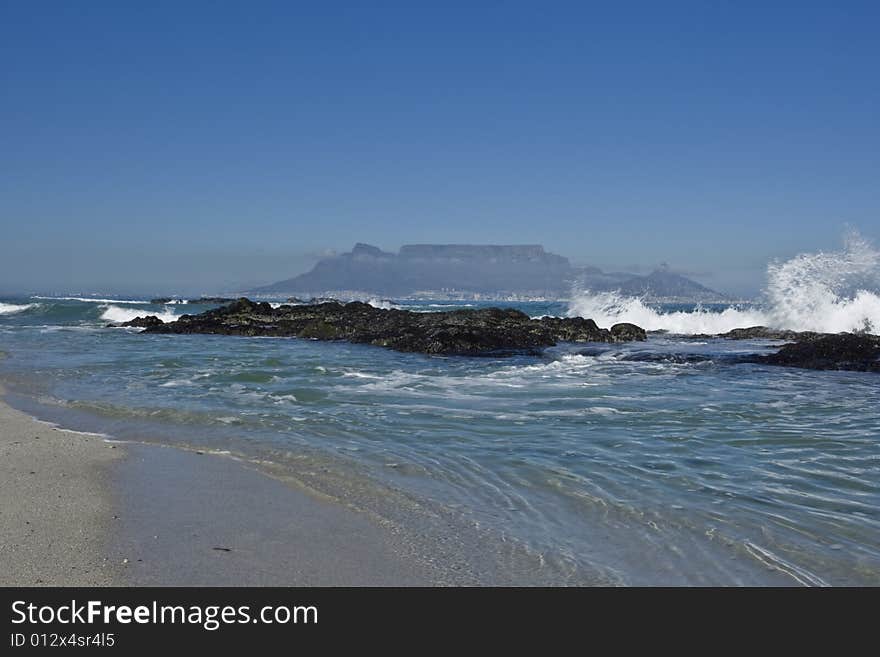 A view of Table Mountain in Cape Town, from Blauwberg beach on a sunny winters day. A view of Table Mountain in Cape Town, from Blauwberg beach on a sunny winters day