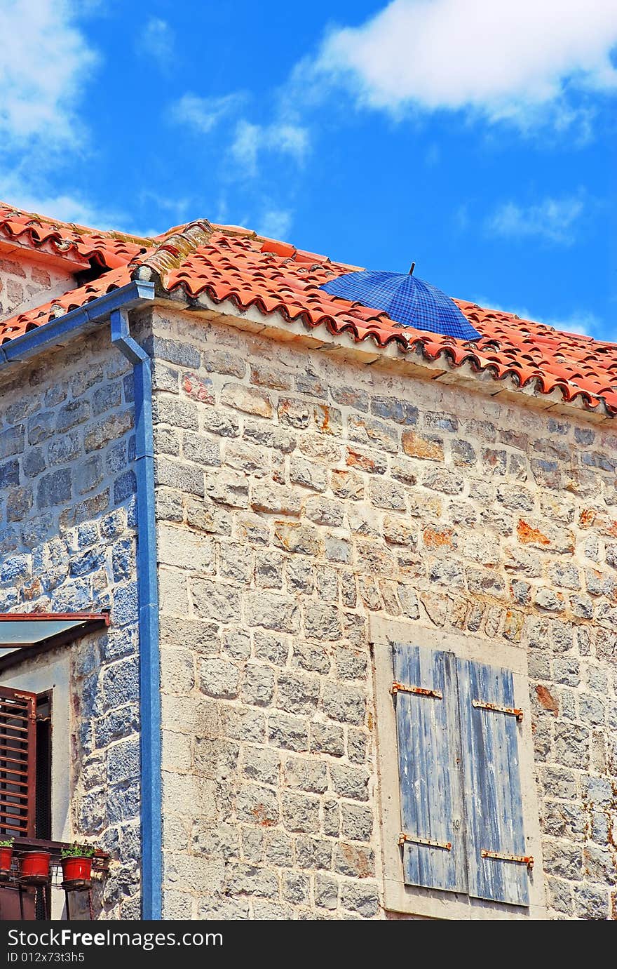 Umbrella on roof. Rain protection