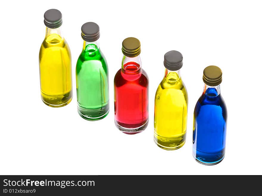 Coloured bottles isolated on white background. Coloured bottles isolated on white background.