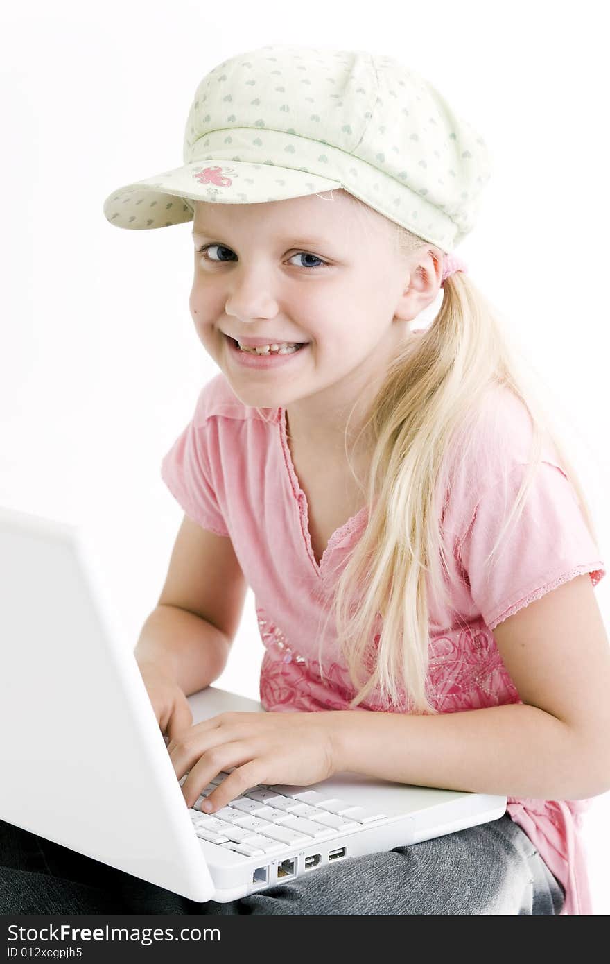 Young girl using a laptop computer over white background