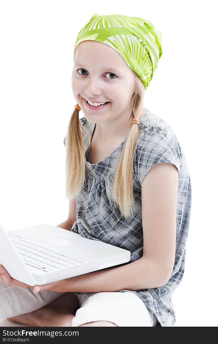 Young girl using a laptop computer over white background