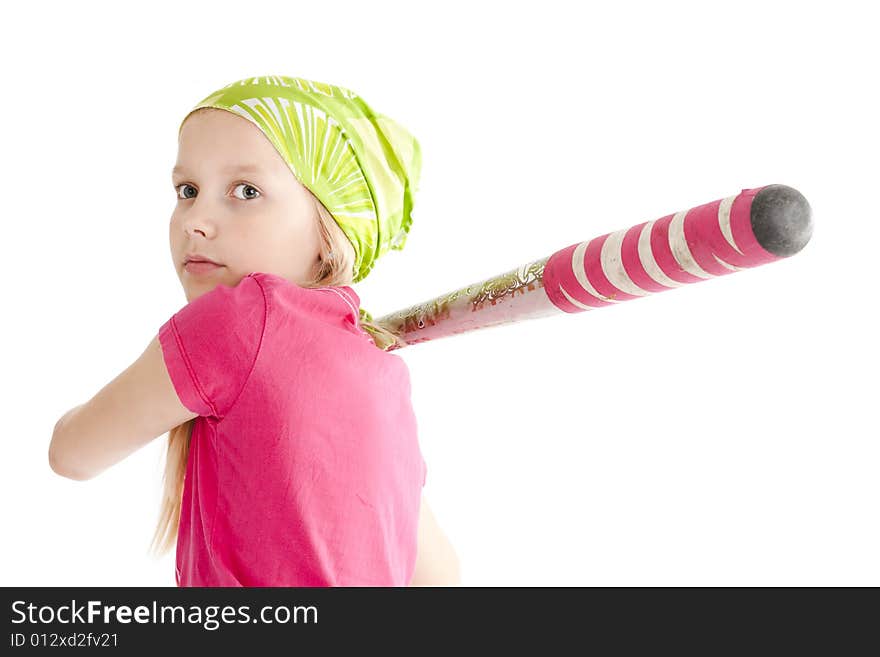 Young softball player hitting the ball with bat