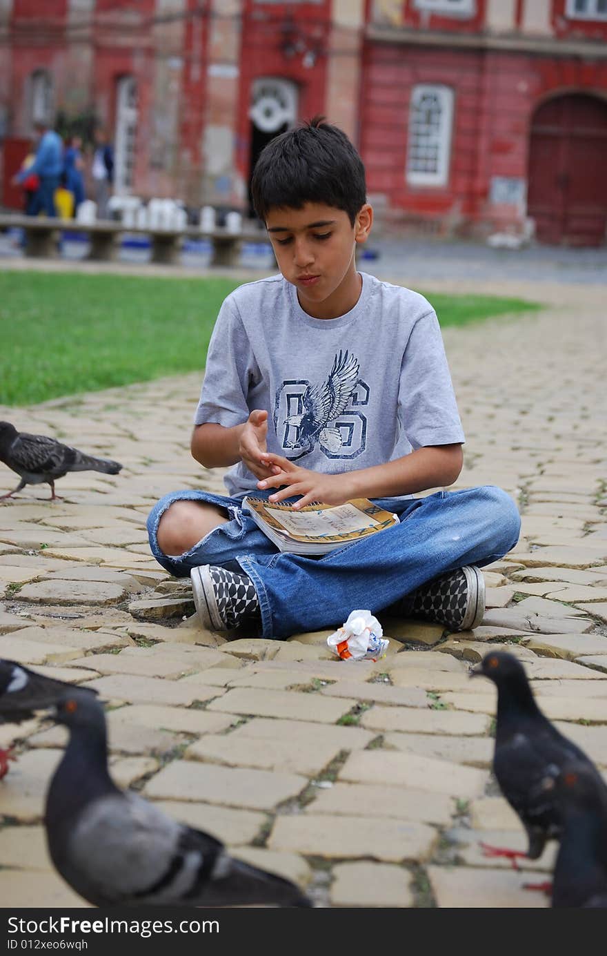 Having some fun, eating together with pigeons. Having some fun, eating together with pigeons