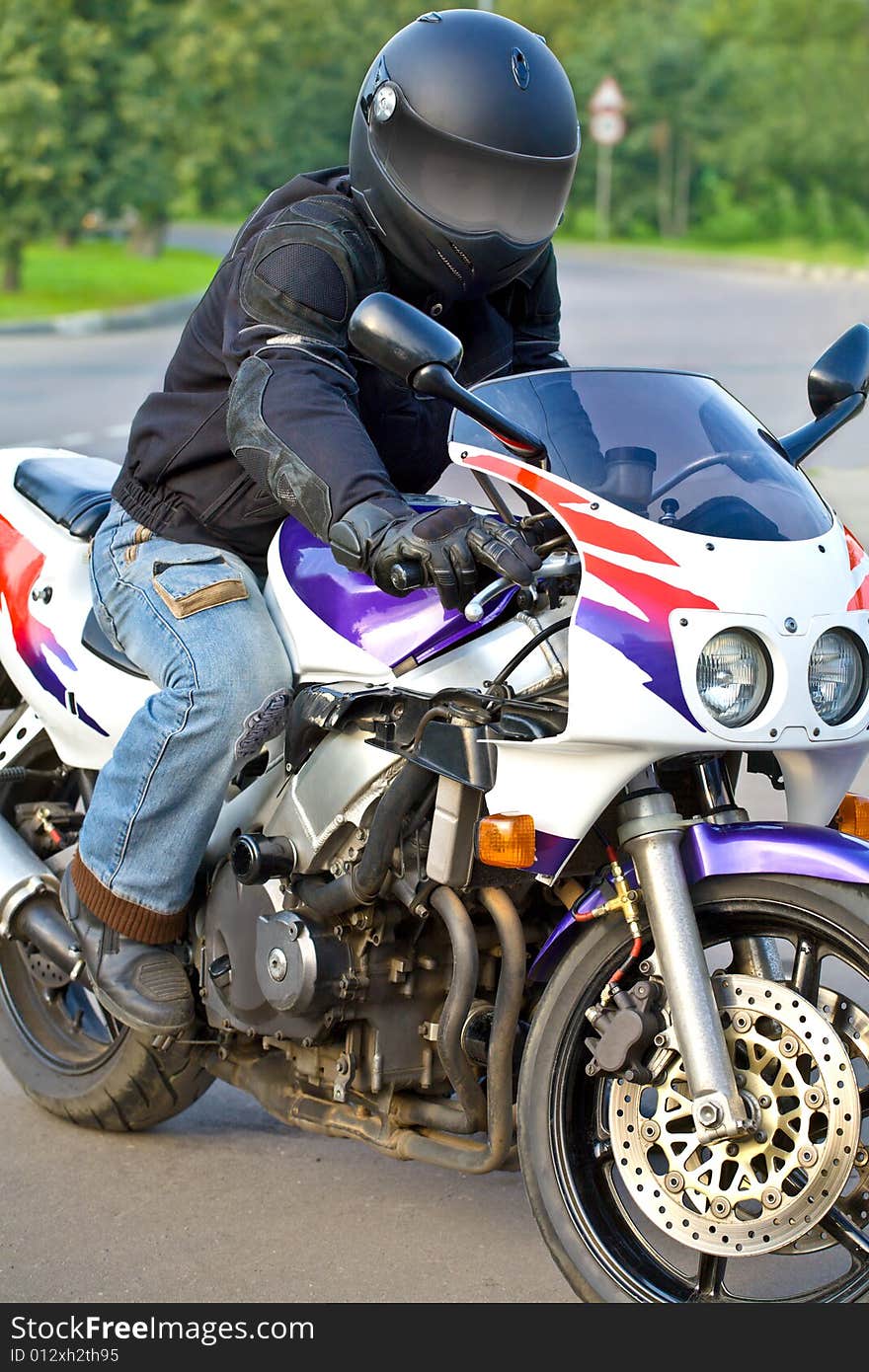 Motorcyclist on the bike on the road. Motorcyclist on the bike on the road