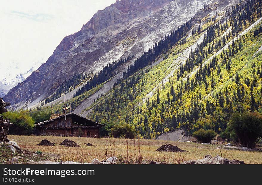 A little house under the big mountains. the location is in Tebit, China. and in Autumn. . A little house under the big mountains. the location is in Tebit, China. and in Autumn.