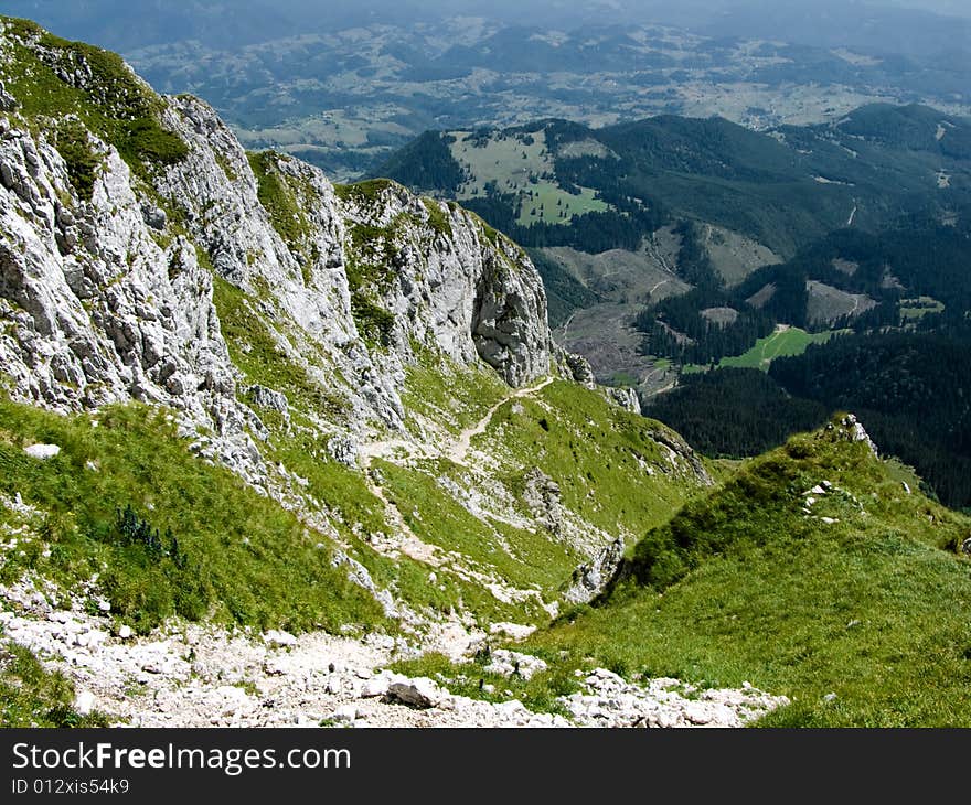 Piatra Craiului ridge, with maximum altitude of 2239 m, is one of the most spectacular mountains in Romania. Piatra Craiului ridge, with maximum altitude of 2239 m, is one of the most spectacular mountains in Romania.