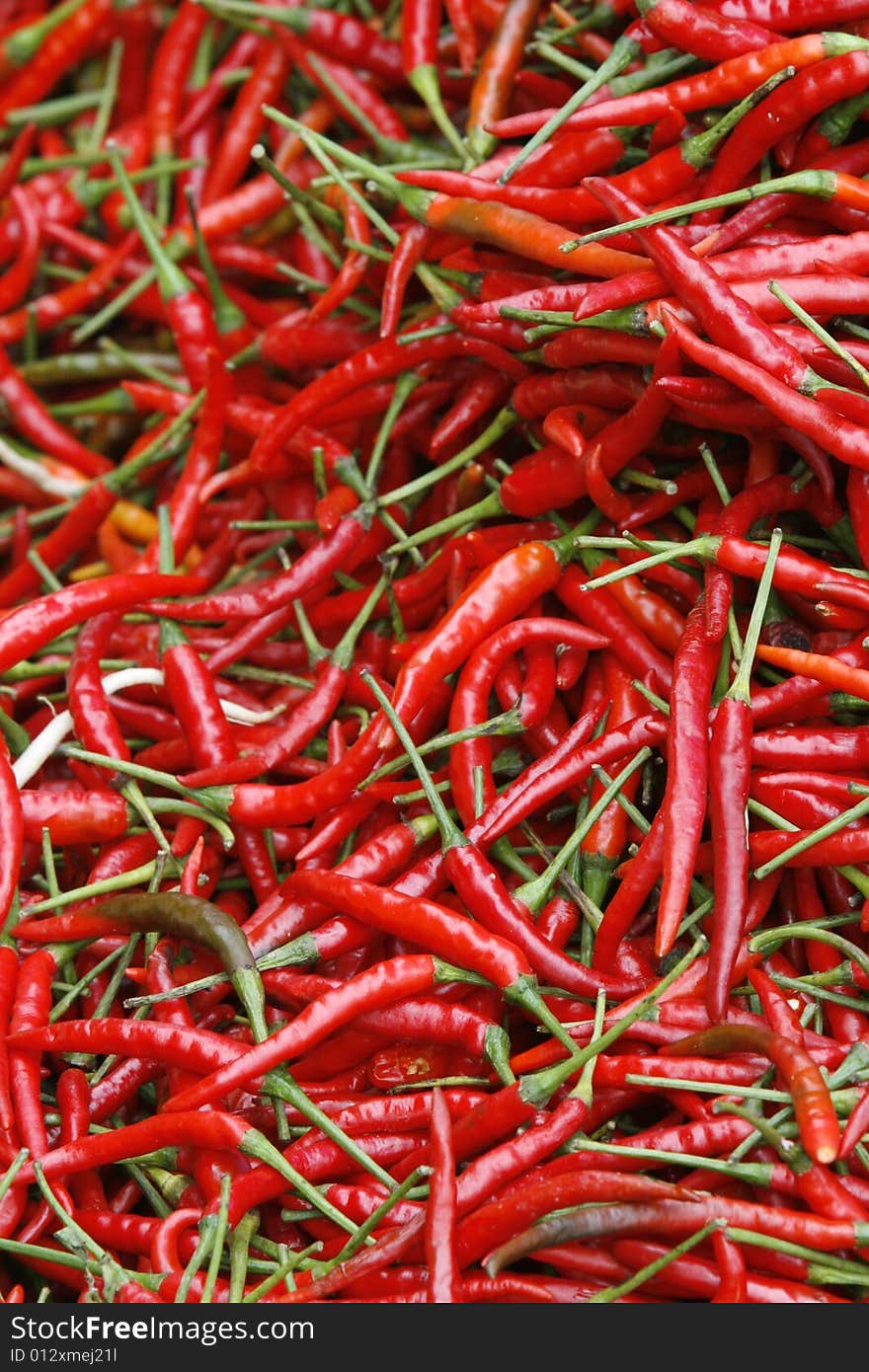 A close up with many red spicy peppers. A close up with many red spicy peppers