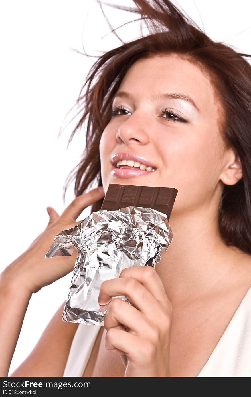 The Young Beautiful Girl Eats Chocolate.