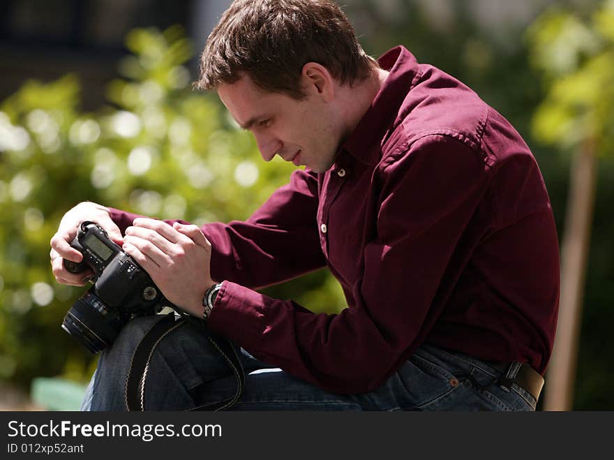 Photographer looking at camera, man with camera