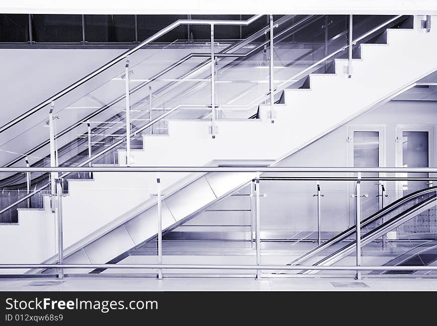 Escalator and stairs in the business center. Escalator and stairs in the business center