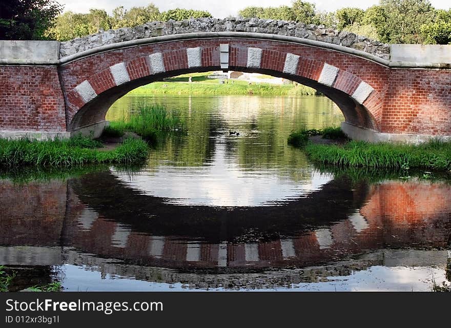 The beautiful old bridge with reflection in water