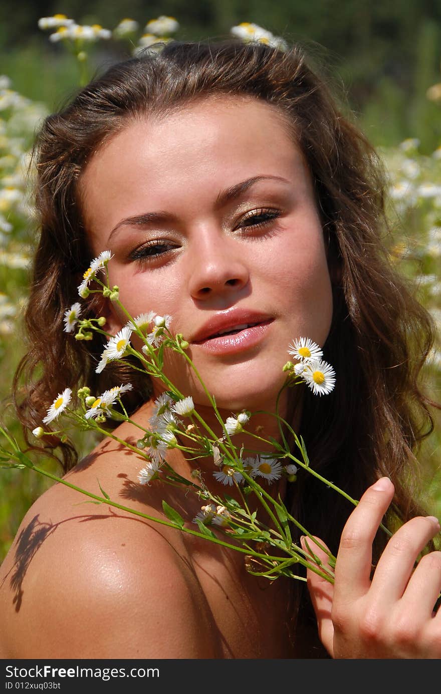 Portrait of the beautiful girl with flowers. Portrait of the beautiful girl with flowers