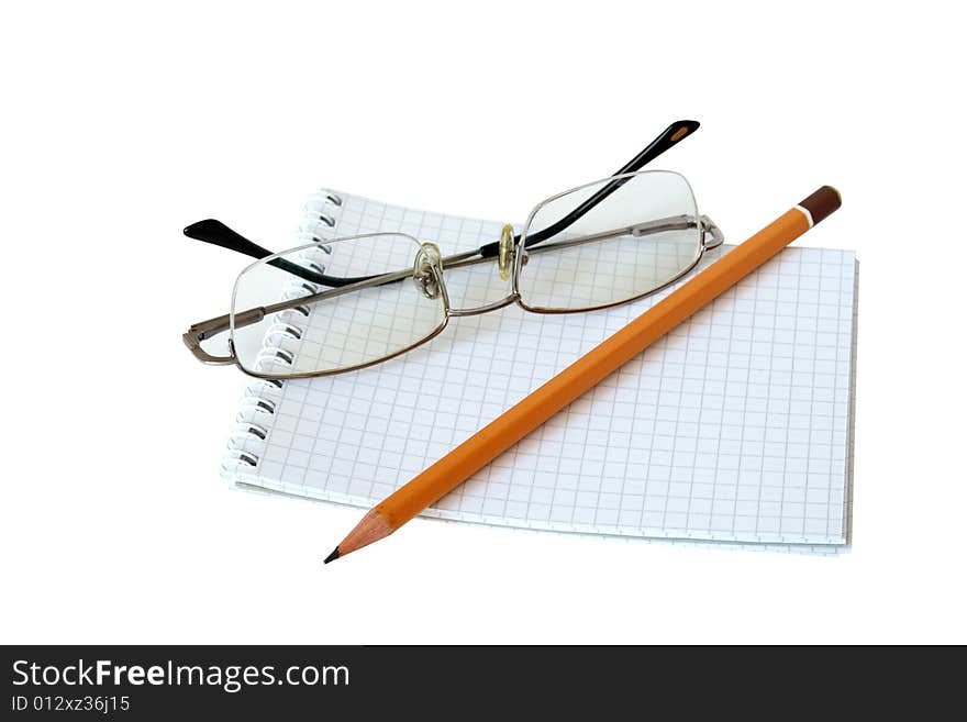 Notebook, spectacles and pencil