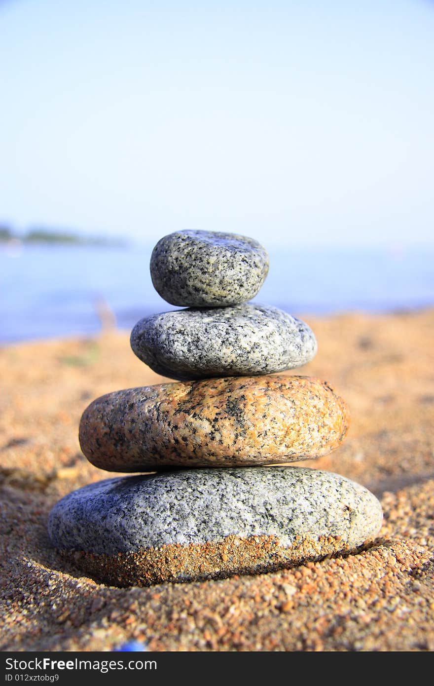 Stones on the seashore, blue sky