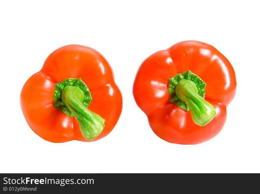 Two sweet red peppers on white ground. Two sweet red peppers on white ground