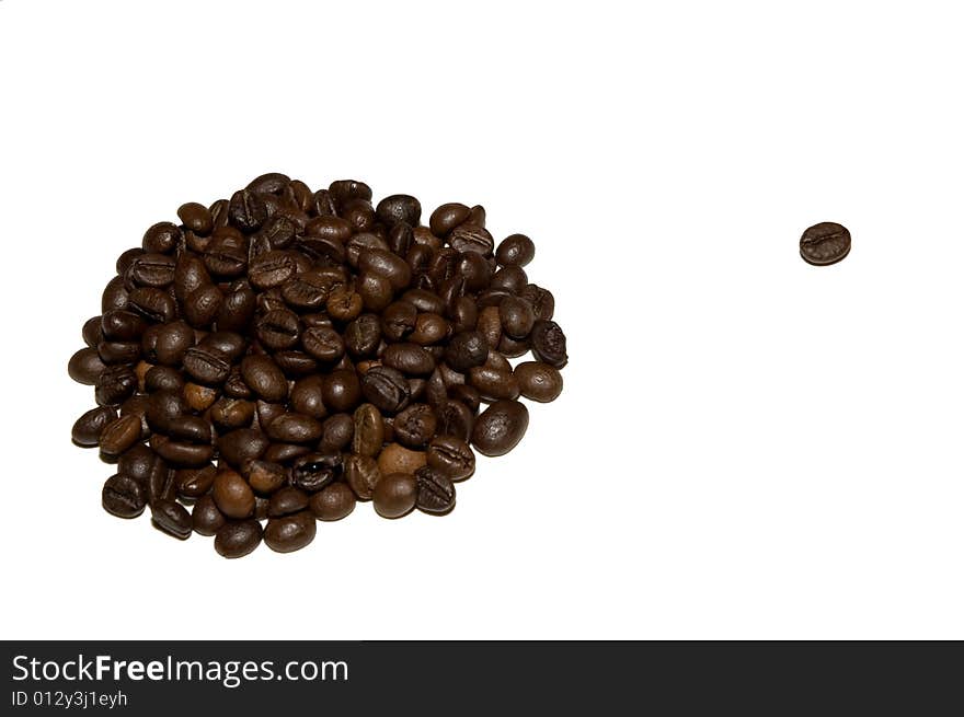 A heap of coffee beans with one singled out bean isolated on white. A heap of coffee beans with one singled out bean isolated on white