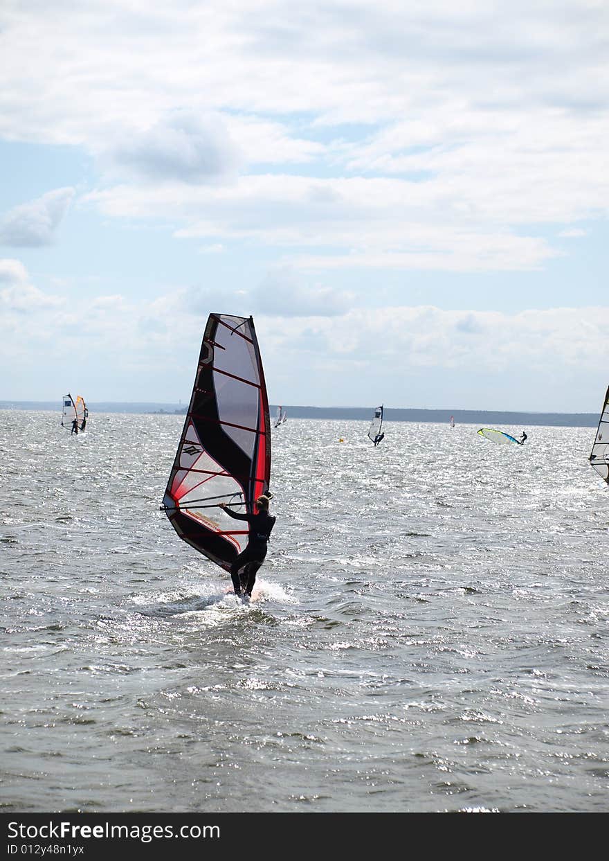 Men on windsurfing